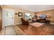 Cozy living room featuring wood floors, a window with natural light, and comfortable seating at 10009 Dodge Dr, Northglenn, CO 80260