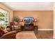 Inviting living room featuring hard wood floors, comfortable seating, and a mounted television at 10009 Dodge Dr, Northglenn, CO 80260