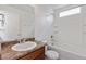 Bathroom featuring a shower-tub combo, a toilet, and a vanity with a mirror, designed for comfort and convenience at 5383 Andes St, Denver, CO 80249