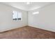 Bright bedroom with plush carpeting, a large window providing natural light, and a comfortable, inviting atmosphere at 5383 Andes St, Denver, CO 80249