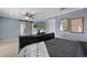 Bedroom with a large tv and sliding barn doors at 5009 Mt Osage St, Frederick, CO 80504