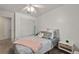 Cozy bedroom showcases neutral carpet, a ceiling fan, closet and a comfortable bed with soft pillows at 5009 Mt Osage St, Frederick, CO 80504