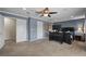 Spacious bedroom featuring neutral carpet, ceiling fan, and a large window for ample natural light at 5009 Mt Osage St, Frederick, CO 80504