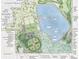 Community plan featuring multi-use fields, sports courts, a dog park, and a lake with fishing pier at 5009 Mt Osage St, Frederick, CO 80504