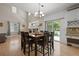 Elegant dining area with hardwood floors, stylish lighting, and access to the backyard at 5009 Mt Osage St, Frederick, CO 80504