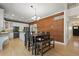 Spacious open-concept dining room, hardwood floors, and white trim at 5009 Mt Osage St, Frederick, CO 80504