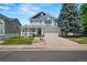 Charming two-story home featuring a welcoming front porch and well-maintained landscaping at 5009 Mt Osage St, Frederick, CO 80504