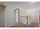 Upstairs hallway with carpet flooring leads to bedrooms via closet door entrances at 5009 Mt Osage St, Frederick, CO 80504