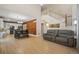 Open floor plan featuring a spacious dining area and adjacent kitchen with wooden accent wall at 5009 Mt Osage St, Frederick, CO 80504