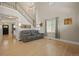 Bright living room with hardwood floors and a staircase at 5009 Mt Osage St, Frederick, CO 80504