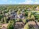 An aerial view of the property showcases beautiful landscaping, mature trees, and neighborhood amenities at 10114 Meade Ct, Westminster, CO 80031