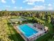 Aerial shot featuring community pool, tennis courts, and manicured grounds, perfect for outdoor enjoyment at 10114 Meade Ct, Westminster, CO 80031