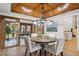 Elegant dining room featuring a wooden ceiling and large round table with stylish chairs at 10114 Meade Ct, Westminster, CO 80031