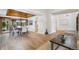 Open concept living space with hardwood floors connecting the living, dining, and kitchen areas at 10114 Meade Ct, Westminster, CO 80031