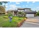 Beautiful two-story home featuring a brick exterior, well-manicured lawn, and attached garage at 10114 Meade Ct, Westminster, CO 80031