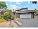 Two-story home featuring a brick exterior, landscaped front yard, and attached two-car garage at 10114 Meade Ct, Westminster, CO 80031