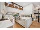 Modern kitchen with sleek white cabinets, stone countertops, and a central island for cooking at 10114 Meade Ct, Westminster, CO 80031