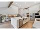 Spacious kitchen features a large island with bar seating, stainless appliances, and wood floors at 10114 Meade Ct, Westminster, CO 80031