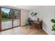 Office features a modern desk, chair, light wood floors, and access to the backyard at 10114 Meade Ct, Westminster, CO 80031