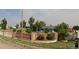 Ranch style home with brick wall and landscaped yard at 21861 E 26Th Ave, Aurora, CO 80019