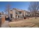 Spacious backyard with lush green grass and an inviting patio perfect for entertaining at 15393 E Louisiana Ave, Aurora, CO 80017