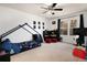 Fun bedroom featuring bed with canopy, window and a ceiling fan for an enjoyable space at 15393 E Louisiana Ave, Aurora, CO 80017