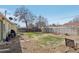 Spacious backyard with a mix of grass and gravel, perfect for outdoor activities and relaxation at 9271 Gaylord St, Thornton, CO 80229