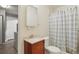 Updated bathroom features a modern vanity, shower with bathtub, and tiled floors at 9271 Gaylord St, Thornton, CO 80229