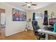 Home office featuring a stylish desk, comfortable chair, and colorful artwork at 9271 Gaylord St, Thornton, CO 80229