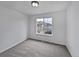 Neutral bedroom features bright white walls, carpet, and a large window at 381 Freestone St, Brighton, CO 80603