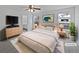 Comfortable bedroom featuring a ceiling fan, bright natural light and easy access to the ensuite at 381 Freestone St, Brighton, CO 80603