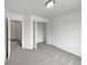 Bedroom with neutral walls, carpeted flooring and closet and entrance to hallway at 381 Freestone St, Brighton, CO 80603