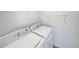 Bright laundry room featuring a washer and dryer with wire shelving at 381 Freestone St, Brighton, CO 80603