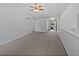 Open living room featuring neutral paint, carpet, and plenty of natural light at 381 Freestone St, Brighton, CO 80603