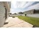 Spacious backyard with a fire pit, grassy lawn, and a white fence for privacy at 1507 Alpine Ave, Berthoud, CO 80513