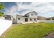 Large backyard with grass, solar panels and a patio, ideal for outdoor living and entertaining at 1507 Alpine Ave, Berthoud, CO 80513
