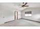 Spacious bedroom featuring vaulted ceiling, fan, gray carpet, and a window at 1507 Alpine Ave, Berthoud, CO 80513