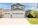 Inviting two-story home with a three-car garage and a well-manicured front yard at 1507 Alpine Ave, Berthoud, CO 80513