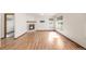 Bright and airy living room featuring a cozy fireplace and hardwood flooring at 1507 Alpine Ave, Berthoud, CO 80513