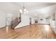 Spacious living room with hardwood floors, fireplace, and staircase at 1507 Alpine Ave, Berthoud, CO 80513