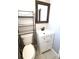 A charming bathroom features a modern sink and a decorative mirror at 8209 Balsam Way, Arvada, CO 80005