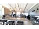 Modern kitchen with granite countertops, stainless steel appliances, pendant lighting, and breakfast bar at 8209 Balsam Way, Arvada, CO 80005