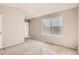 Well-lit bedroom with neutral walls and carpet at 6448 Silver Mesa Dr # B, Highlands Ranch, CO 80130