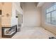 Living room with fireplace and large window at 6448 Silver Mesa Dr # B, Highlands Ranch, CO 80130