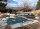 Community pool with safety cover and surrounding patio at 6448 Silver Mesa Dr # B, Highlands Ranch, CO 80130