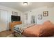 Bright bedroom features hardwood floors, modern decor, and comfortable furnishings at 4820 W 13 Ave, Denver, CO 80204
