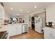 Bright kitchen with ample countertop space, seamlessly flowing into the living and dining area at 4820 W 13 Ave, Denver, CO 80204