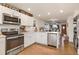 Modern kitchen featuring stainless steel appliances and ample counter space, great for cooking at 4820 W 13 Ave, Denver, CO 80204