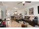 Inviting living room with a large sectional couch, open to the kitchen, creating a seamless living space at 4820 W 13 Ave, Denver, CO 80204