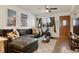 Comfortable living room with a leather sectional, perfect for relaxing and entertaining guests at 4820 W 13 Ave, Denver, CO 80204